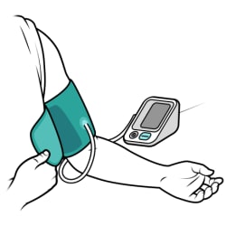 Person’s arm resting on flat surface with palm facing up, shirt sleeve rolled up and blood pressure cuff wrapped around upper arm above elbow.