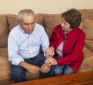 People sitting on couch together.