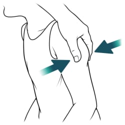 Hand pinching child’s skin on back of upper arm.
