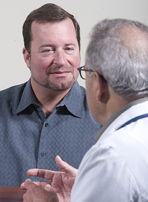 Patient talking to doctor.