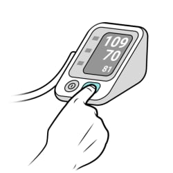 Finger pressing start button on monitor.