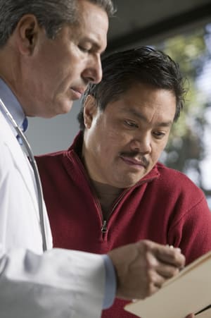 Person talking with doctor.